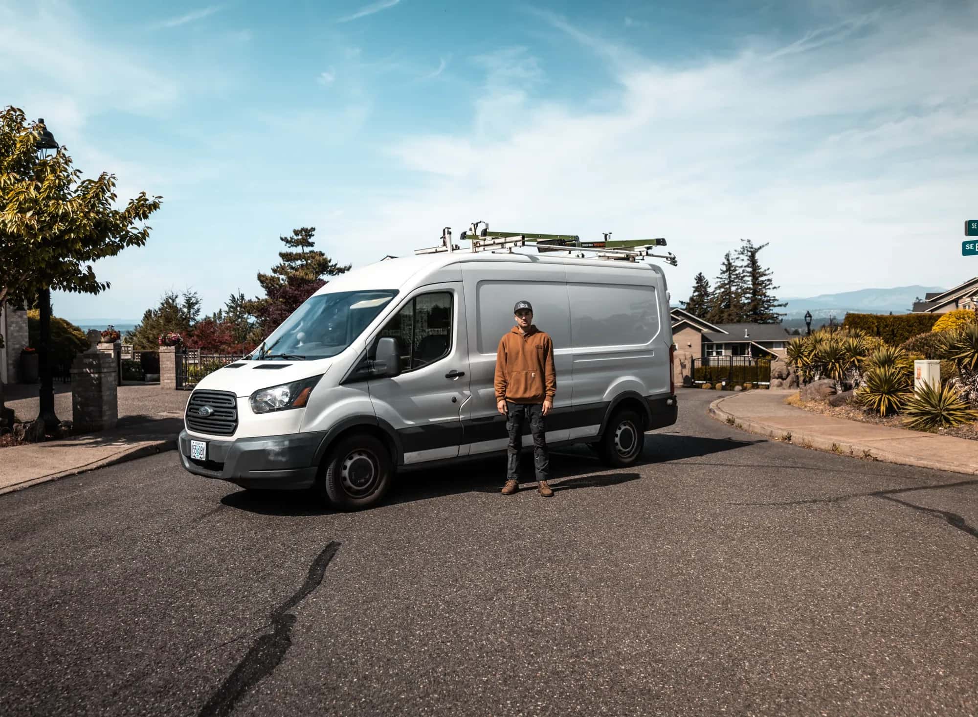 Ed, owner of Eds Heating & Air, standing by his service van, wider shot